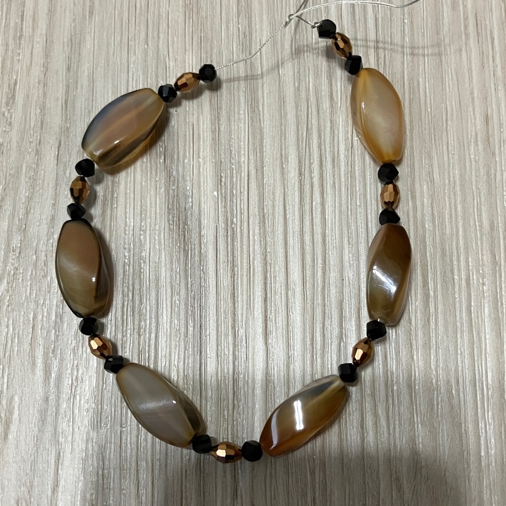 Black and Bronze beads + beautiful “cat’s eye” beads in this stunning bracelet.